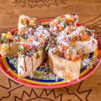 Grilled Bruschetta · Our homemade ciabatta grilled and topped with extra virgin olive oil, sea salt, tomatoes, ba...