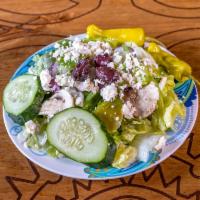 Greek Salad · Chopped lettuce, Feta cheese, green peppers, onion, mushroom, cucumber, pepperoncinis and Ka...