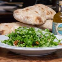 Ruchetta Salad · Organic arugula, toasted pecans, apricots, and Chevre with extra virgin olive oil and lemon ...