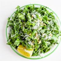 Arugula Salad  · Arugula topped with Pine nuts and Parmigiano Reggiano and served with extra virgin olive oil...