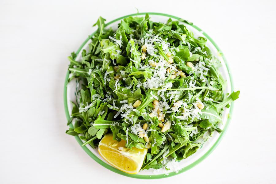 Arugula Salad (Small) · Arugula topped with Pine nuts and Parmigiano Reggiano and served with extra virgin olive oil, lemon, and sea salt.