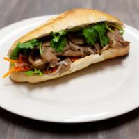Grilled Pork Banh Mi · French bread, cilantro, green leaf, pickled daikon and carrot.