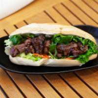 Grilled Beef Tenderloin Banh Mi · French bread, cilantro, green leaf, pickled daikon and carrot.