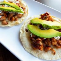 2  Chicken Tacos · grilled chicken topped with cheese and avocado
