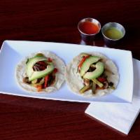 2 Vegetarian Tacos · handmade corn tortilla, sauteed mushroom, bell peppers, onion and zucchini, topped with chee...