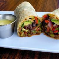 Vegetarian Burrito · Grilled mushrooms, bell peppers, zucchini and onion. Served with black beans, cheese, lettuc...