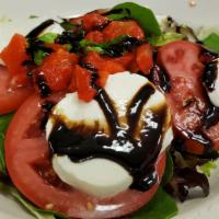 Caprese Salad · Fresh mozzarella, tomato, balsamic vinaigrette, extra virgin olive oil, basil, and roasted r...
