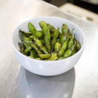 Not Your Typical Edamame · Soy beans seared in the shell, flash sautéed with soy and hot sauces. Salty and nutty goodne...