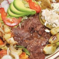 Tampiquena Platillo · Skirt steak. Served with fried potatoes, 1 green sauce enchilada, grilled green onions, gril...