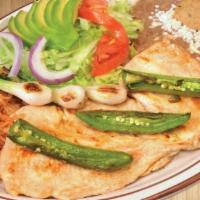 Pechuga Asada Platillo · Grilled chicken breast. Served with rice, beans, grilled jalapeno pepper, green onions, and ...