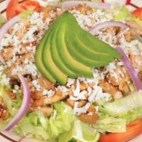 Ensalada Mezquite · Chicken. Includes tomato, avocado, lettuce, radishes, onion, cucumber, cheese, lemon, and ra...