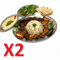Double Mix Grill Aleppo  Family Style ( For 4 people ) · 10 pieces of beef shish, 2 skewer of beef kafta, 10 pieces of chicken shish and grilled vege...