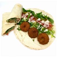 Falafel wrap · Served with parsley, lettuce, tomatoes, mint leaves, pickles and tahini sauce.