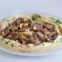Hummus with Meat · Hummus dip, topped with beef Shawarma and pine nuts.
