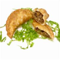 Sambousik order ( 2 pieces ) · Ground beef, sauteed onions and spices stuffed in dough and fried.