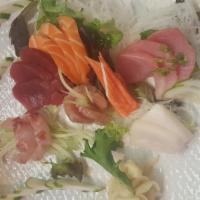 Sashimi Deluxe Entree · Assorted slices of fresh raw fish, served with soup or salad.