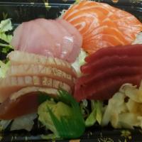 Four Sashimi Entree · 4 pieces of white tuna, 4 pieces of tuna, 4 pieces of salmon and 4 pieces of yellowtail, ser...