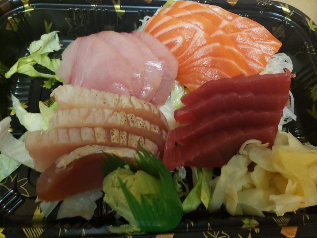 Four Sashimi Entree · 4 pieces of white tuna, 4 pieces of tuna, 4 pieces of salmon and 4 pieces of yellowtail, served with soup or salad.