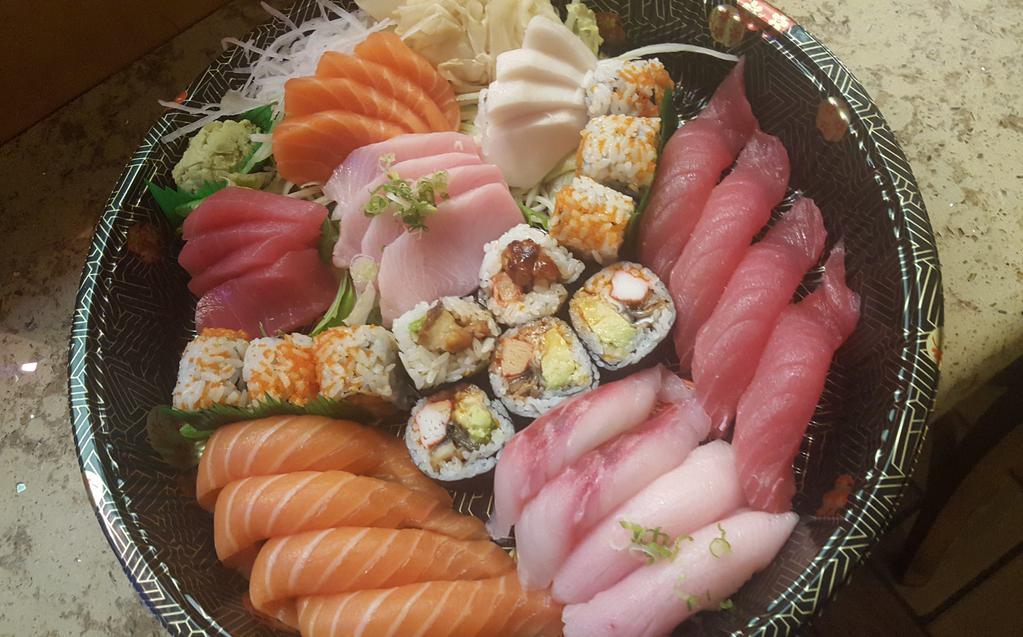 Party Sushi and Sashimi Entree · For 2 people. 14 pieces of sashimi, 8 pieces of sushi, 2 of chef's choice special roll, served with soup or salad.