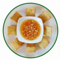 Fried Tofu · Deep fried tofu served with sweet and sour sauce topped with ground peanut.