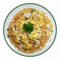 Crab Fried Rice · Stir-fried with crab meat, egg, onion, scallion, peas, carrot.