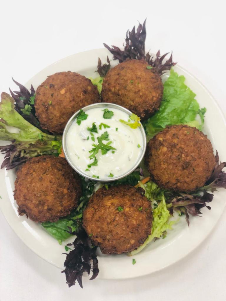 Falafel · Mashed garbanzo beans, garlic, peppers, parsley, and Turkish spices.  Deep fried and served with Tzatziki sauce.