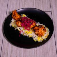 Chicken Shish Kebab · Marinated tender chunks of chicken grilled to perfection. Served with rice pilaf, grilled ve...