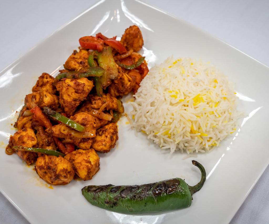 Chicken Sautee · Chicken sautee with green peppers, onions, tomatoes, oregano, and spices. Served with rice pilaf. 