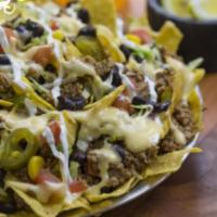 Nachos · Start off with our mouthwatering nachos, then add your choice of protein, rice, beans, and a...