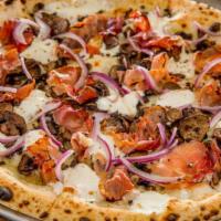 The Speckenwolf Pizza · Mozzarella, speck, mushroom, onion and oregano.