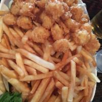 Popcorn Shrimp · Popcorn shrimp with french fries.