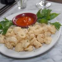 Calamaretti e Zucchine Fritti con Pomodoro Piccante · Fried calamari and zucchini. Served with a spiced tomato sauce.