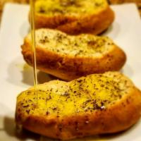 Pane Aglio · Toasted Italian bread, rubbed with fresh garlic cloves and drizzled with extra virgin olive ...