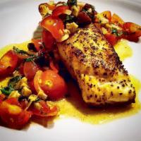 Branzino al Livornese · Pan-seared fillet of striped bass sauteed with white wine, tomatoes, Gaeta olives and capers...