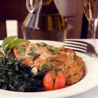 Vitello Piccata · Veal medallions sauteed in white wine, lemon and capers. Served with sauteed spinach.