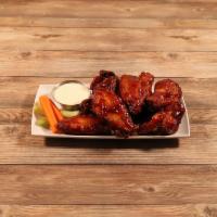 Bone-In Wings · Served with bleu cheese or ranch dressing, carrots, and celery sticks.