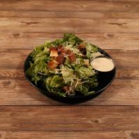 Classic Caesar Salad · Crisp romaine, shredded Parmesan cheese, garlic croutons, and tossed in a creamy Caesar dres...