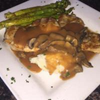 Kilkenny Chicken · Two 6 oz. grilled chicken breasts topped with Guinness mushroom gravy and served with colcan...