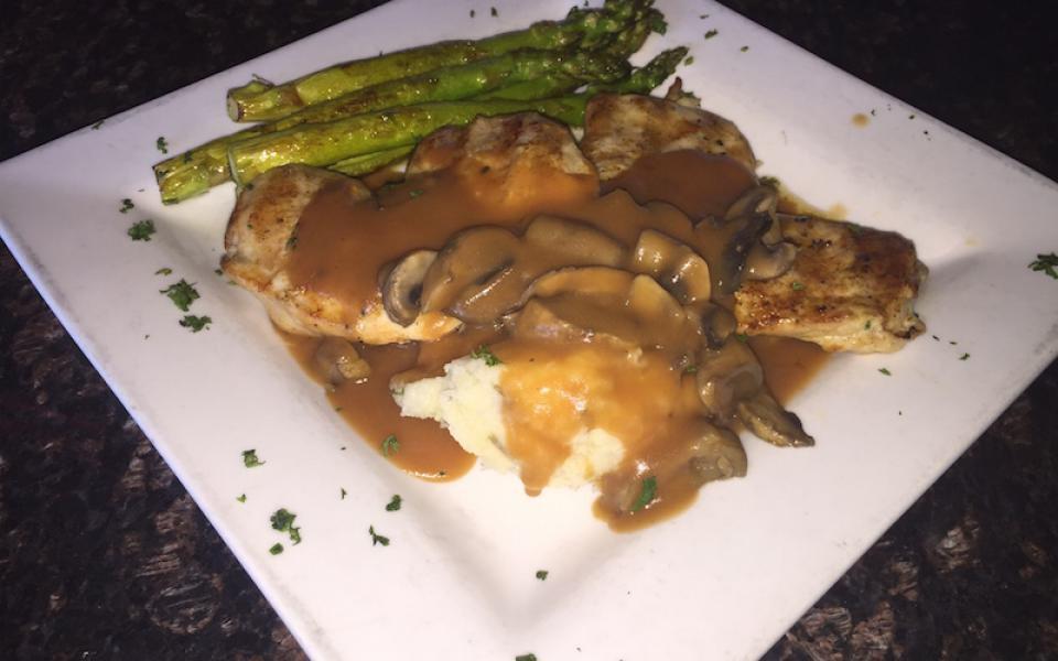 Kilkenny Chicken · Two 6 oz. grilled chicken breasts topped with Guinness mushroom gravy and served with colcannon mashed potatoes and grilled asparagus.