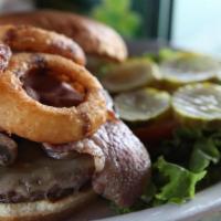 Belfast Burger · 8 oz. Black Angus burger topped with Irish rasher bacon, Irish cheddar, sauteed mushrooms, a...