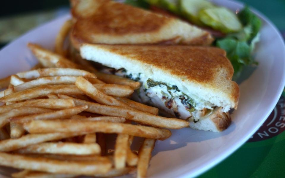 Chicken Spinach Melt · Grilled chicken breast, melted Swiss cheese with spinach, and artichoke dip on grilled sourdough bread.