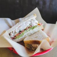 Tuna Salad Sandwich · Mayonnaise, lettuce, tomato, and pickle. Served with your choice of bread.