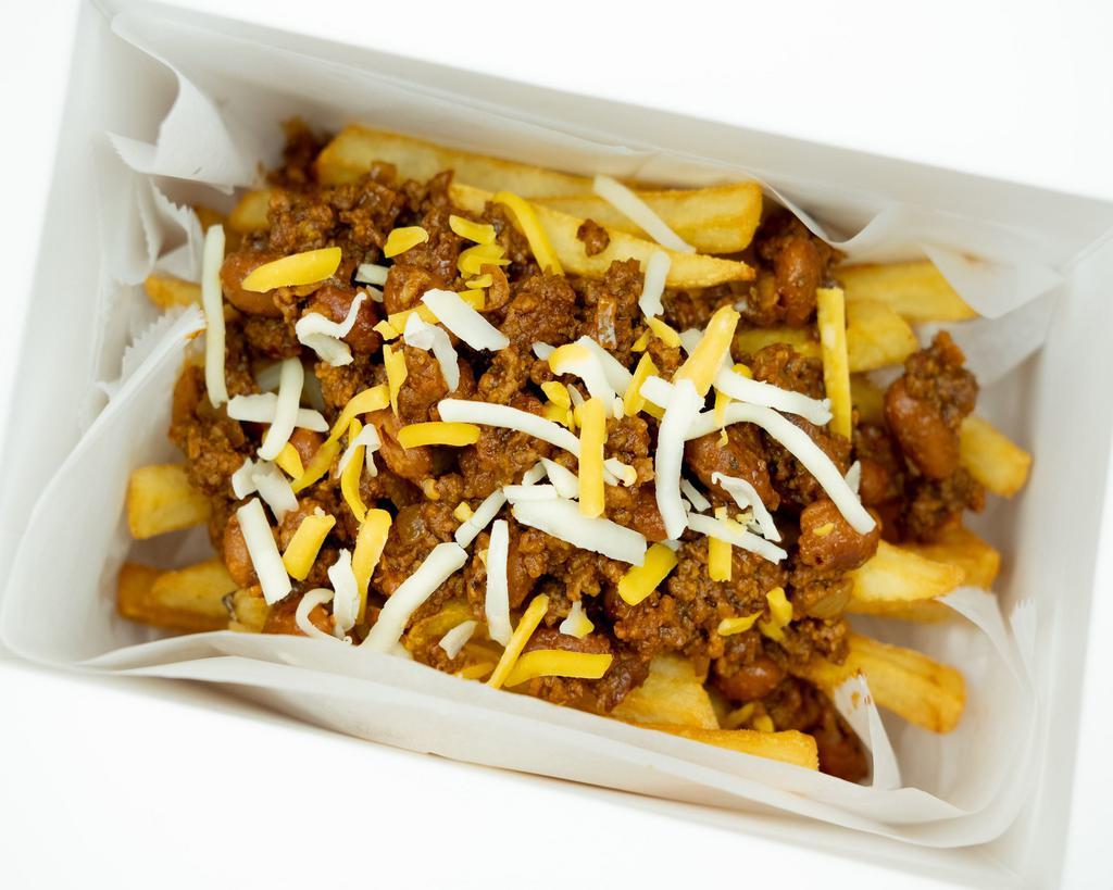 Chili Cheesus Fries · Classic chili with pinto beans and shredded cheese atop some shoestring fries.