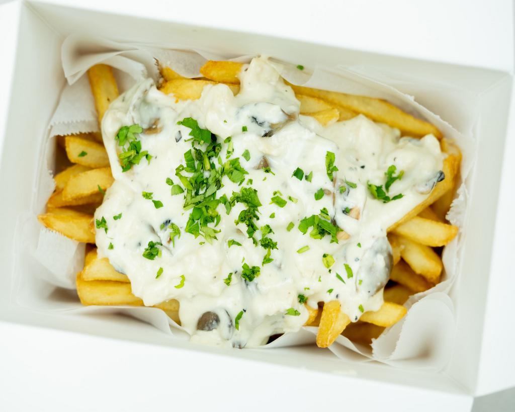 Chicken Mushroom Garlic Truffel Fries · Our crispy fries topped with a creamy, garlic chicken and mushroom sauce. Finished with a drizzle of truffle oil. 