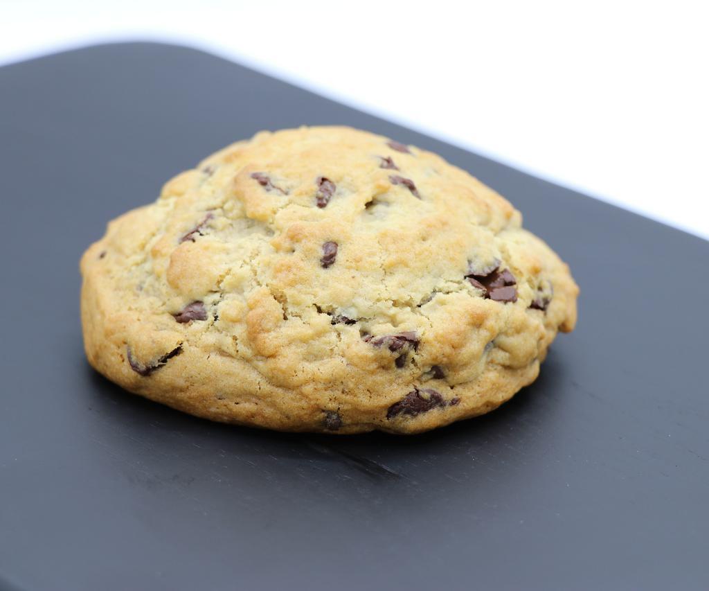 Chocolate Chip  · 
Chocloate Chip:
Our flagship cookie: She’s an extra thiccc chocolate chip cookie that thinks shes the top of a cupcake. This LORGE GORL is moist and cake-like and invokes that “made by a grandma” feeling you get when eating an awesome chocolate chip cookie. Like a warm hug, but in cookie form.