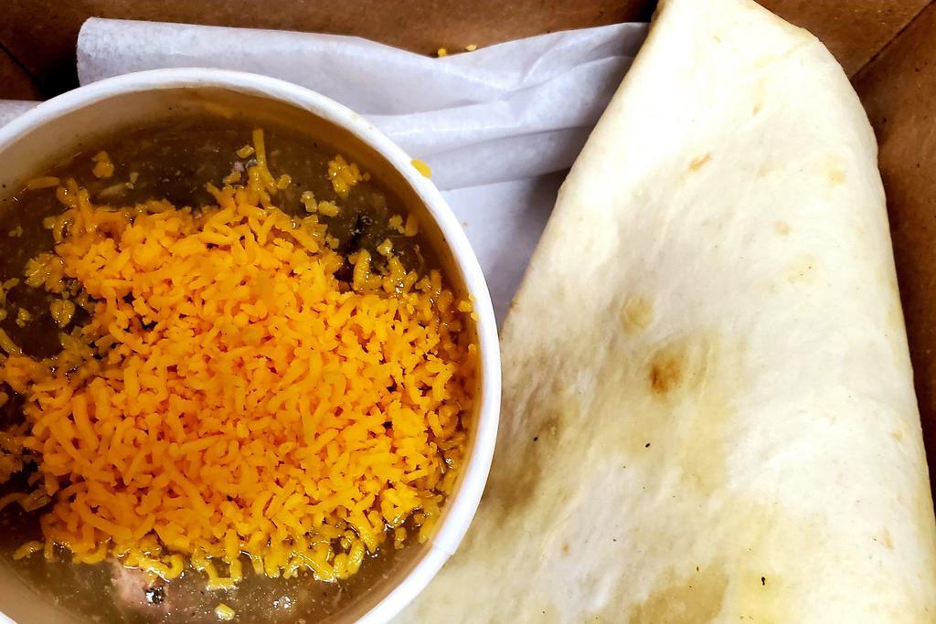 Bowl of Green Chili · House made pork green chili served with shredded cheddar and flour tortilla.