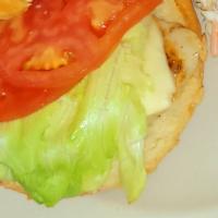 Grilled Chicken Sandwich · White American cheese, lettuce and tomato. Served with choice of house made potato chips, co...