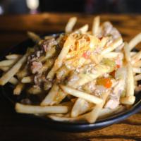 Nacho Fries · Green chili, cheese sauce, taco beef, pico de gallo.