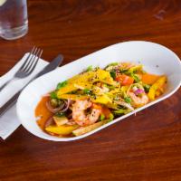 Mango Salad · Prawns, ginger, cashews, red onions, cilantro, mint, green onions and bell pepper.