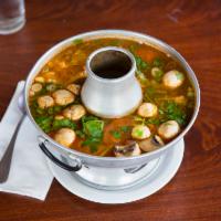 Tom Yum Soup · Hot and sour soup, lemongrass, kaffir lime leaf, mushroom, tomato, cilantro and green onion.